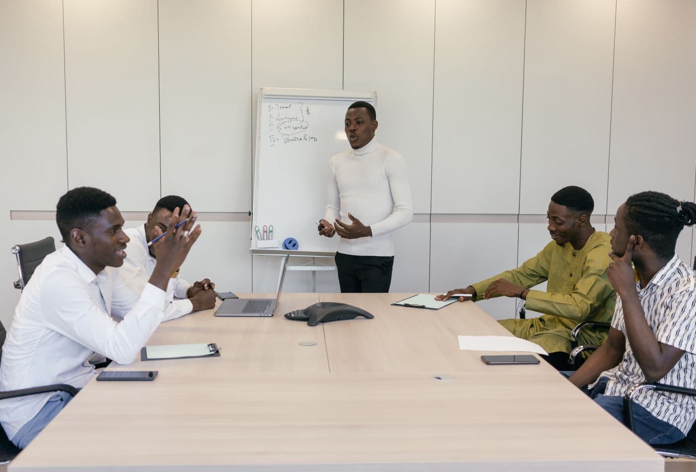 A delivery team working through a solution design in a boardroom